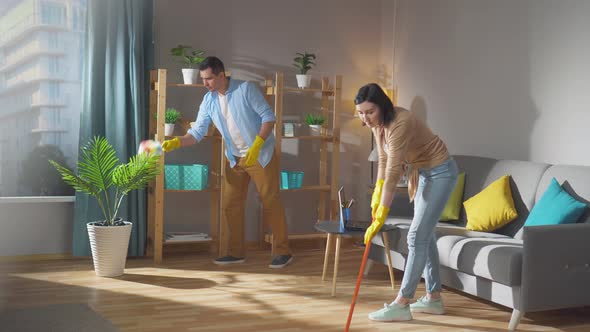 a Couple of Spouses Does Cleaning in an Apartment or House