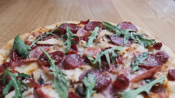 Appetizing Pizza on a Wooden Board in a Restaurant