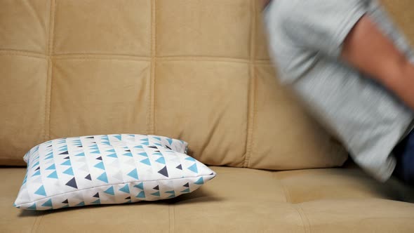 Smiling Boy Falls on the Sofa Face Down Slow Motion