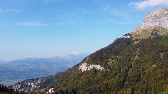 Aerial tilt down view over Passy, in the french Alps, on a warm fall season day. Haute Savoie.