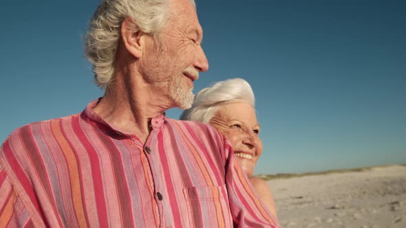 Senior couple enjoying free time at the beach