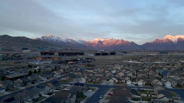 Silicon Slopes in Lehi, Utah with office buildings and a suburban community below the snow-capped mo