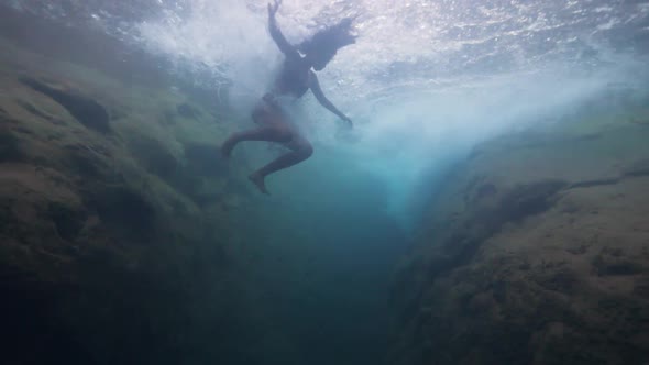 Underwater Shot Young Tourist Woman Jumps Into Waterfall in Slow Motion