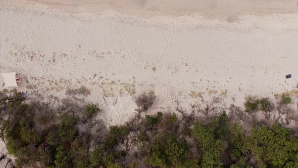 Aerial View of Green Forest White Sand Beach and Blue Transparent Turquoise Ocean Sea with White