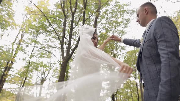 Caucasian Groom with Bride in the Park. Wedding Couple. Happy Family. Newlyweds