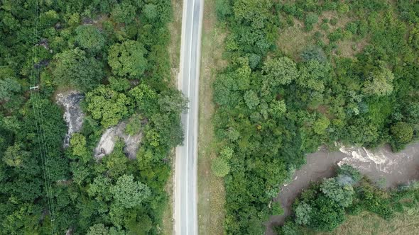 Aerial View of the Green Plains in Mountains and Trafic Road, Tanzania, Africa. The the Green Hills