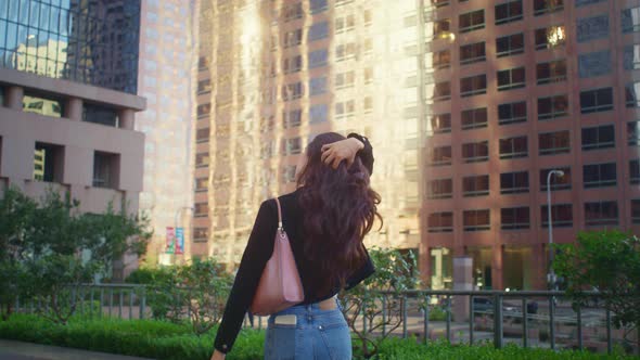 Asian Girl Posing in Front Skyscraper