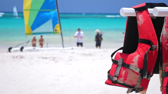 Life Safety Jackets on Tropical Beach. Lifejackets for Water Sport Activity