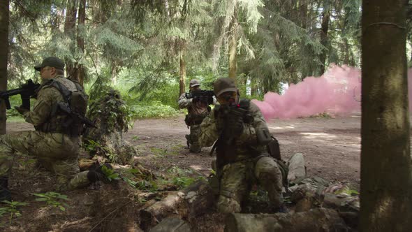 Soldiers Holding Assembly Point to Evacuate Injured Companion in Arms alt