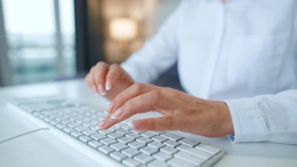 Female Hands Typing on a Computer Keyboard. Concept of Remote Work.