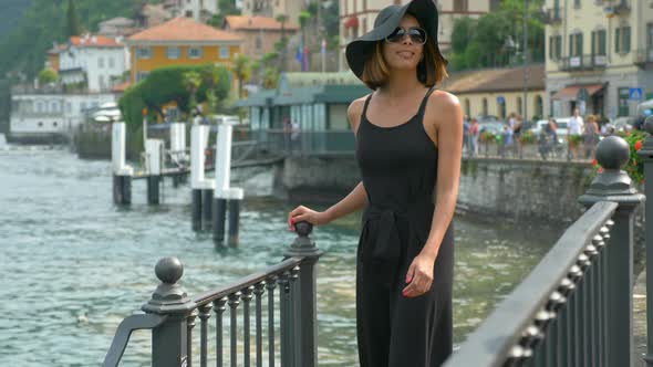 A woman traveling in a luxury resort town near Lake Como, Italy, Europe.
