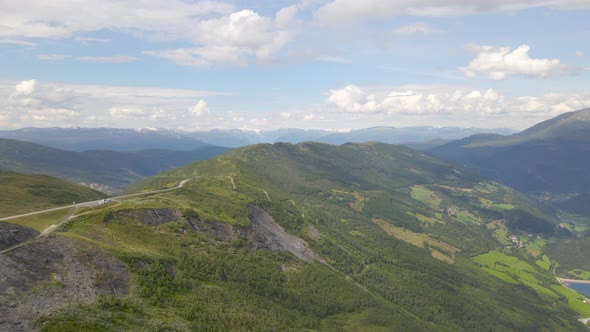 Scenic road on top of Vika mountain, Norway; rising high altitude drone view