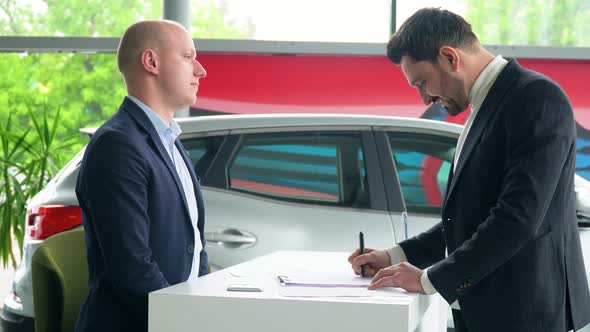 Seller and Buyer Sign a Car Purchase Agreement