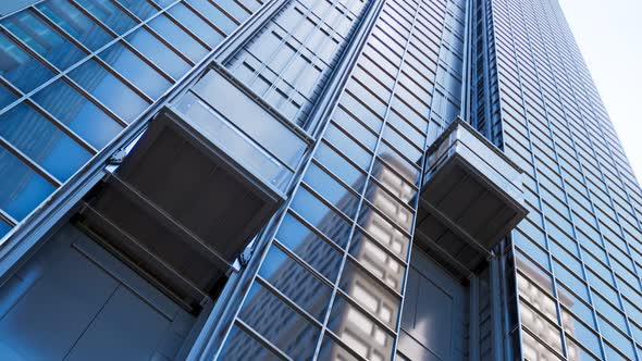 Exterior elevator cabins traveling upwards on a skyscraper glass facade. 4KHD