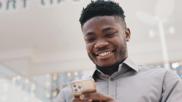 Closeup Young Happy Man Looking at Phone Screen Smiling Enjoying Distance Communication Reads