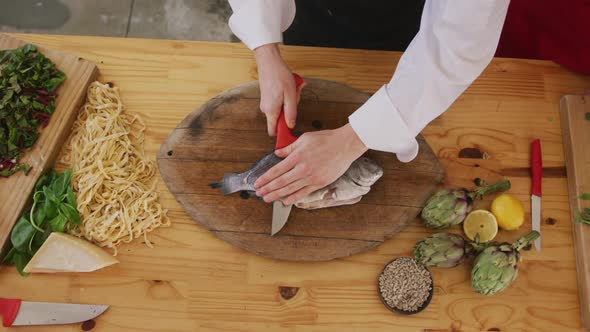 Chef cutting a fish