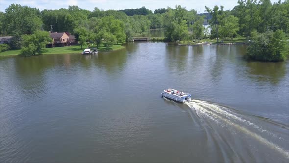 Drone Shot of a Pontoon Boat on Lake Shannon, Michigan