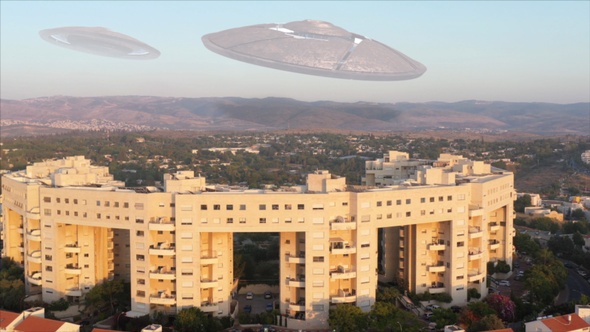 Ufo flying saucers over the mountains near city- Aerial 