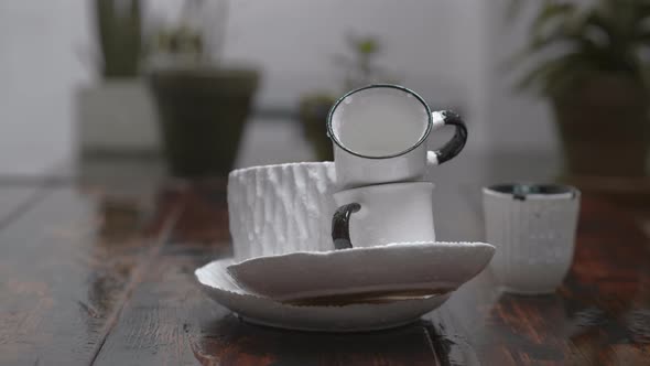 Still life with dishware under the rain