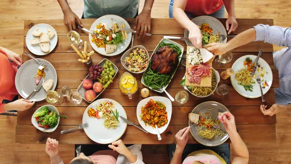 Group of People Eating at Table with Food 20