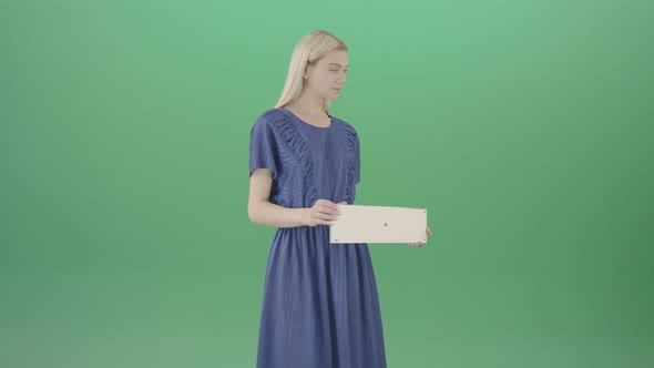 Elegant Woman In Blue Dress Posing With Advertisment Text Plane Mockup And Posing on Green Screen