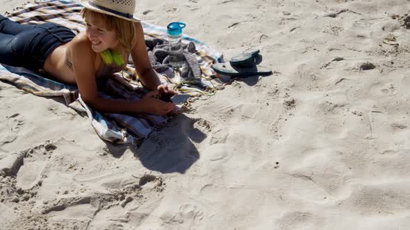 Teenage girl relaxing on beach 4k