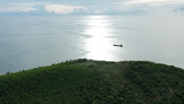 Helicopter flying back to barge after delivering fuel to remote telecom pole