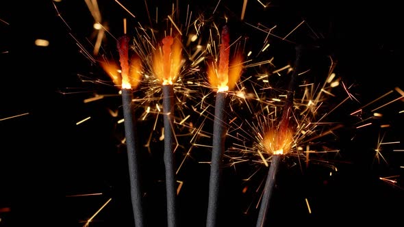 Bengal Fires New Year Sparkler Candles Sparkling Lights Burning on a Black Background Slow Motion