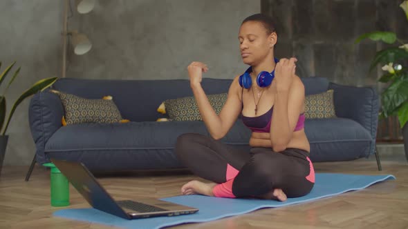 Sporty Yogi Black Woman Meditating in Lotus Pose