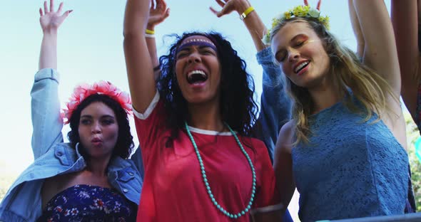 Female friends having fun at music festival 4k