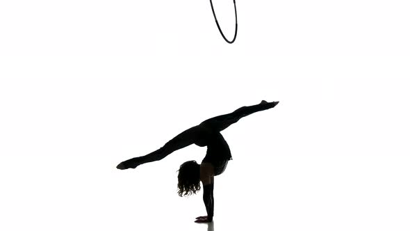 Gymnast Girl Figure Isolated on White Background. Black Silhouette of Gymnastic Woman.