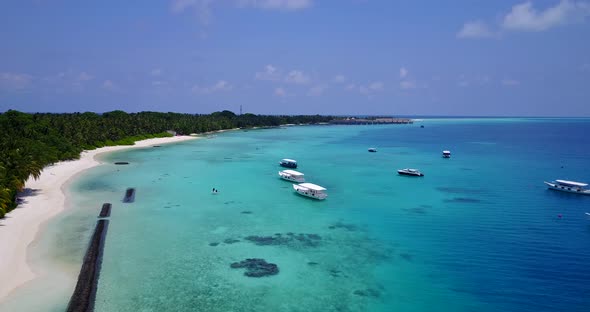 Luxury flying abstract view of a white sand paradise beach and aqua blue water background