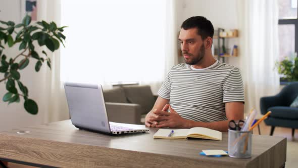 Man with Laptop Having Video Call at Home