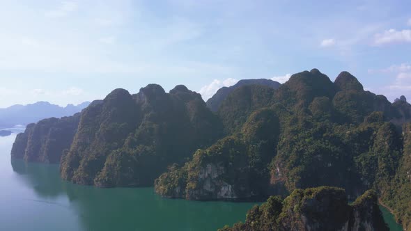 Aerial view landscape view Mountain in lake Refection sky with cloud on lake water. Khaosok Thailand