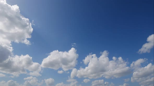 Time lapse of white cloud moving pass around sky background