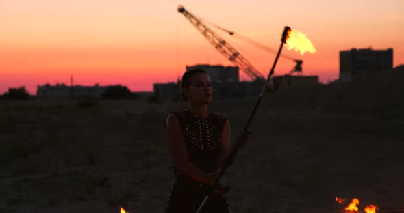 Fire Dancers Against Sunset