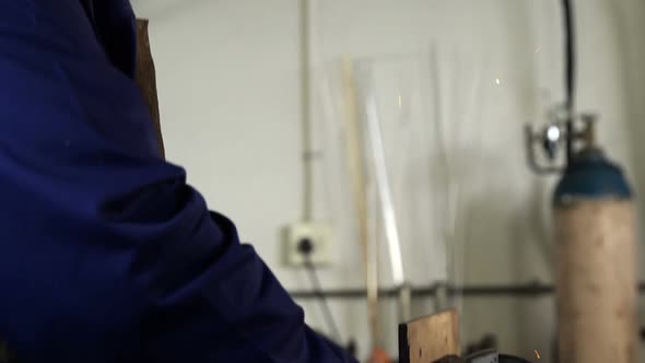 Welder working at work shop