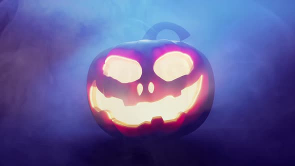 Halloween Pumpkin glowing by candle in dark smoke atmosphere