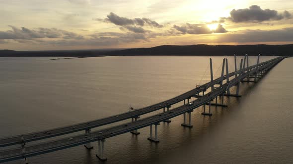 An aerial shot of the Mario M. Cuomo Bridge taken on the north side. The drone camera dolly out from