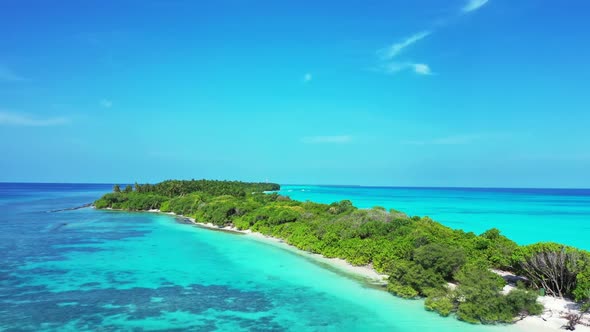 Aerial flying over nature of idyllic shore beach trip by blue water with white sandy background of j