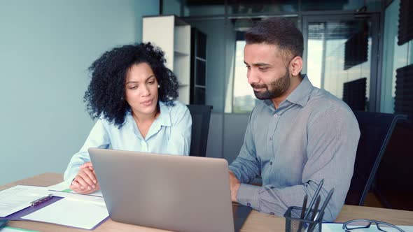 Multiracial Cheerful Colleagues Sitting at Desk Pc Laptop Computer in Office