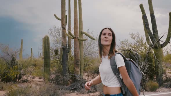 Slow Motion Beautiful Young Smiling Tourist Woman Hiking Along Hot Cactus Desert National Park Under