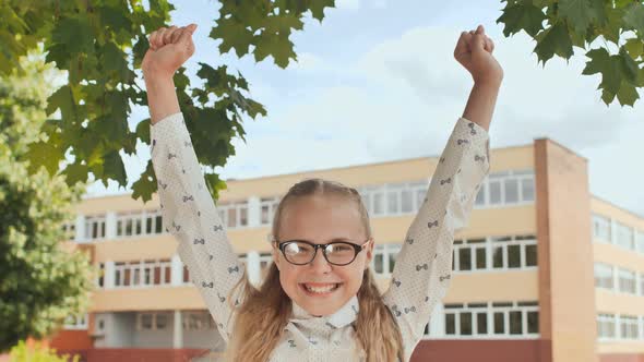 Happy Eleven Year Old Schoolgirl Jumps in Happy Emotions.