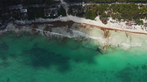 Top View of Busy Tropical Beach with Unrecognized Tiny People Relaxing Enjoying During Weekend in