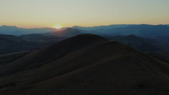 Aerial Filming of the Sunset in the Mountains