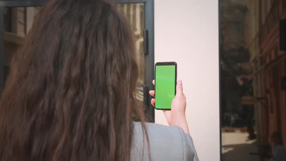 Closeup Girl Having Video Call By Mobile Phone with Green Screen Outdoors