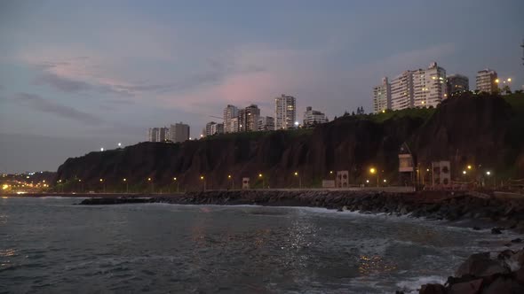 Sunset over sea, buildings and highway on Miraflores, Lima, Perú