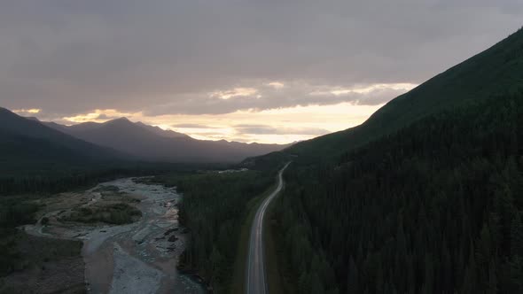 Beautiful View of Scenic Road By Glacial River at Sunset