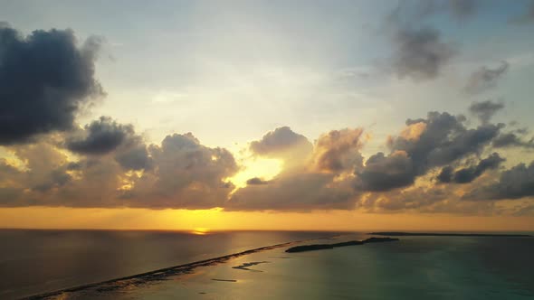 Wide flying abstract view of a sunshine white sandy paradise beach and turquoise sea background in v