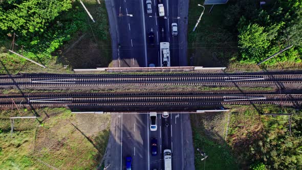 Cars and Trucks Driving Along Road and Bridge